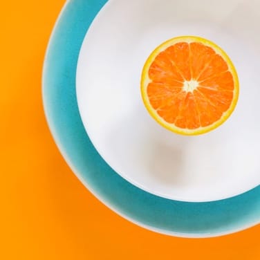 Fresh orange fruit slices on a plate